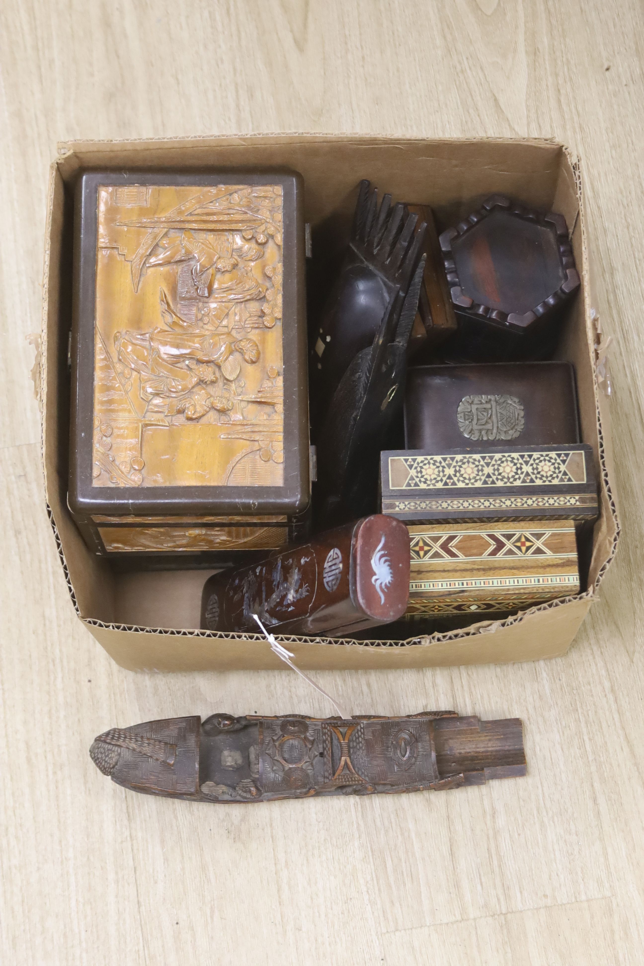 A quantity of Chinese and other carved wood boxes and wood carvings